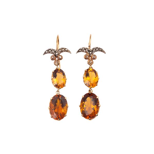 Long pendant earrings in 14 kt gold, silver, diamonds and orange quartz
