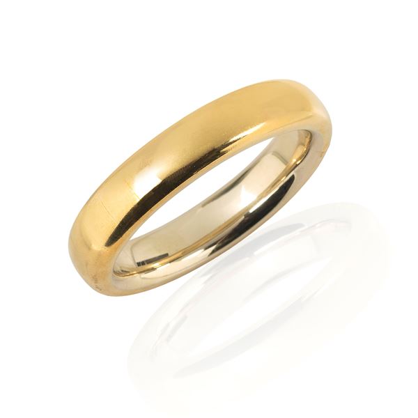 Large rigid bracelet in 18 kt yellow and white gold