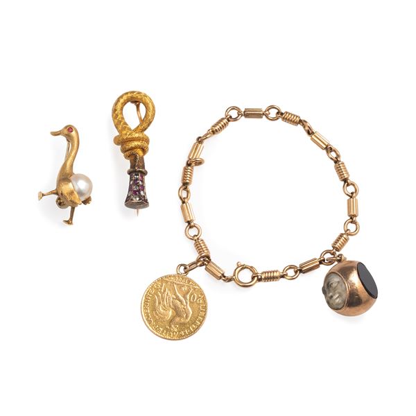 Cornucopia brooch, goose brooch and bracelet in 18 kt rose gold with compass and 20 franc coin 1904