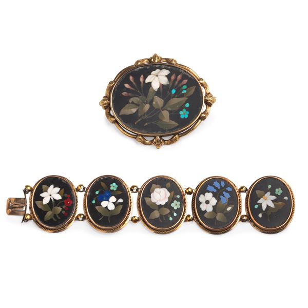 Large brooch and bracelet in 9 kt gold and semiprecious stones with flowers