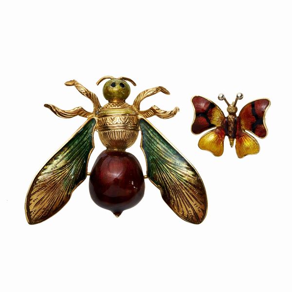 Two animal brooches